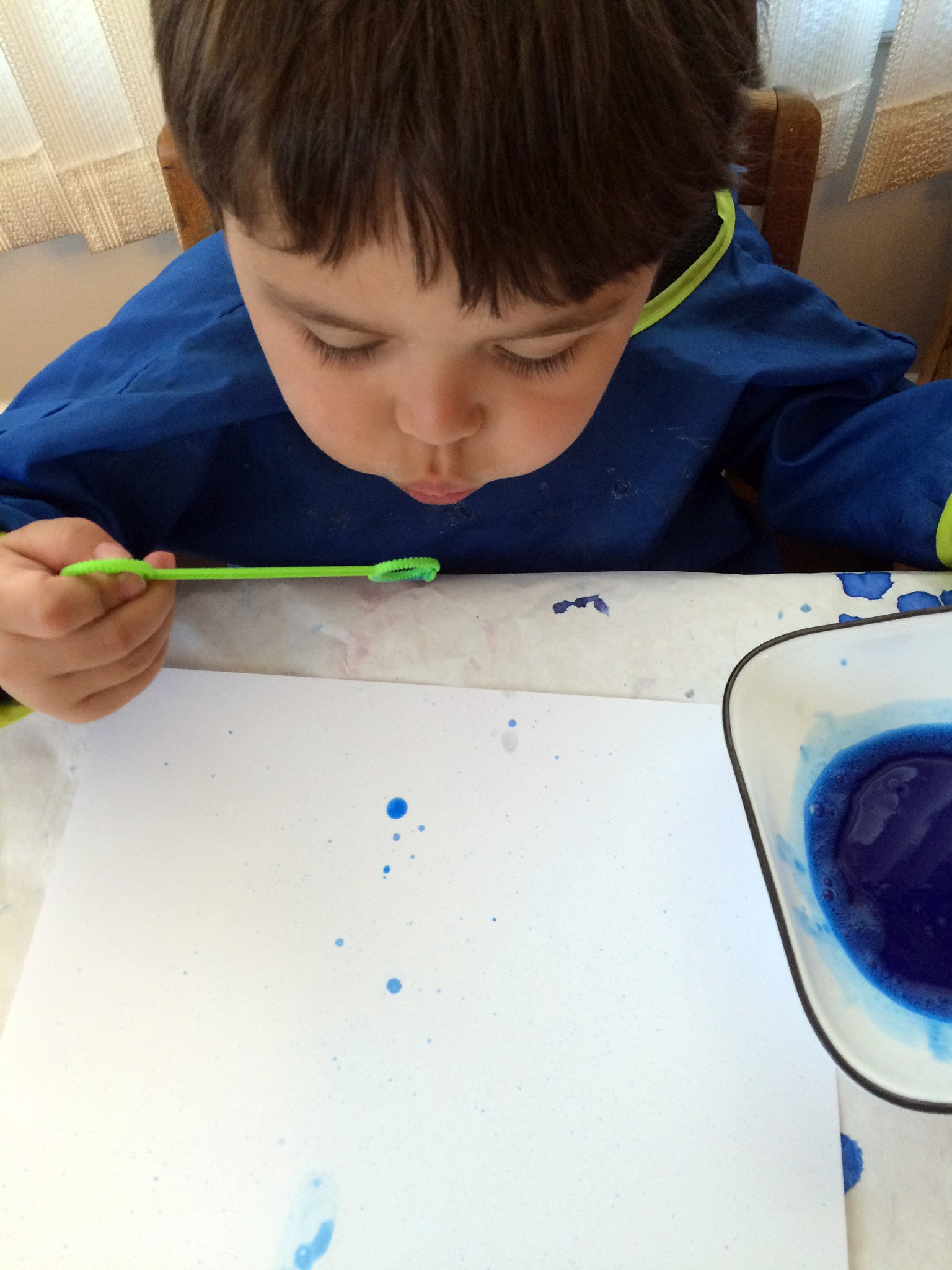 Bubble Painting, creative art activity using wind energy, to go along with May's Ivy Kids kit featuring the book The Wind Blew by Pat Hutchins. 