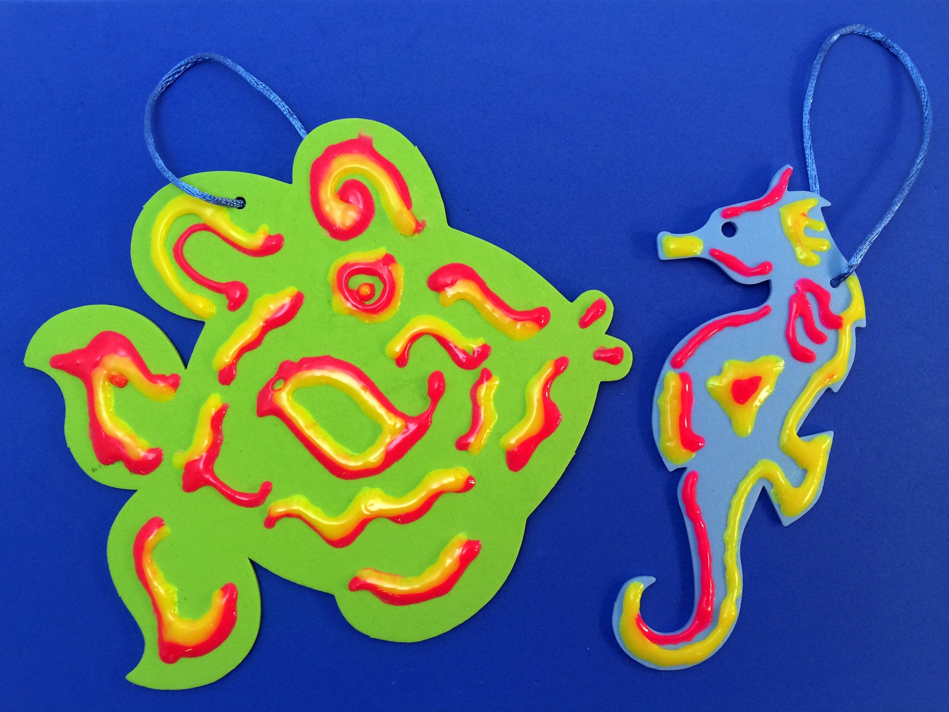 Art Activity inspired by the book Over in the Ocean in a Coral Reef: Create a 3 Dimensional fish and Seahorse Ornament with puffy paint